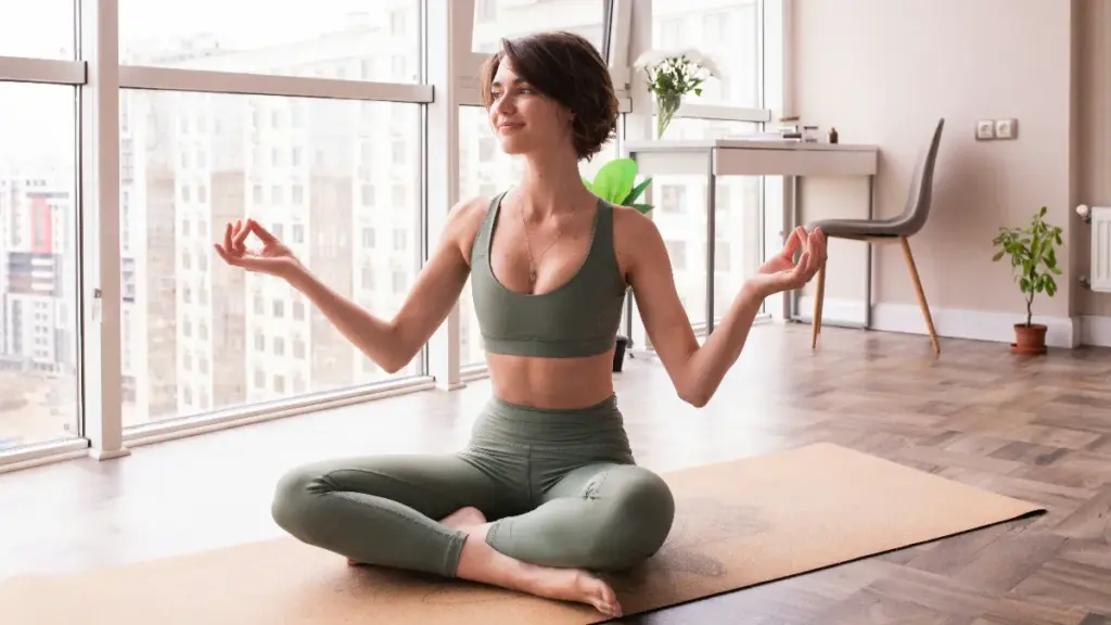 a woman is sitting on the ground